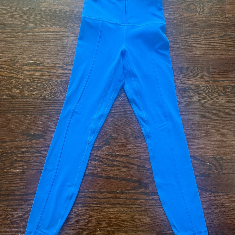 Lululemon leggings. Bright blue color with zip front waist band. Size 2.